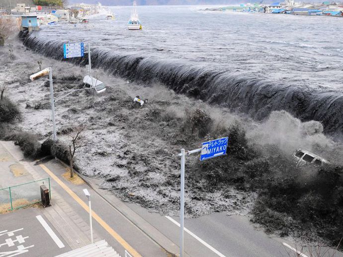 A tsunami hits the east coast of Japan on 11 March 2011..